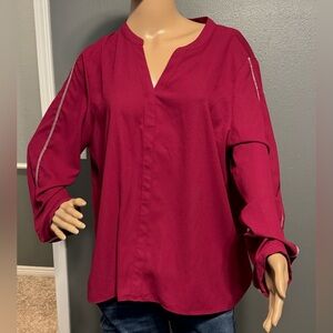 Jennifer Lopez silky top with accents on the sleeve